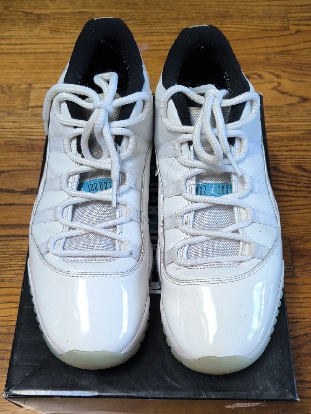 Jordan 11 Low-Top Sneakers with Light Blue Tongue Accents